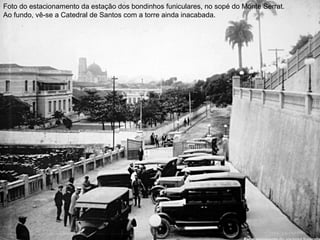 Foto do estacionamento da estação dos bondinhos funiculares, no sopé do Monte Serrat.
Ao fundo, vê-se a Catedral de Santos com a torre ainda inacabada.
 