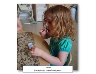 KARPAS
Noa Levin dips karpas in salt water.
 