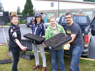 Youth group volunteers starting vegetable seed for Foodbank Garden