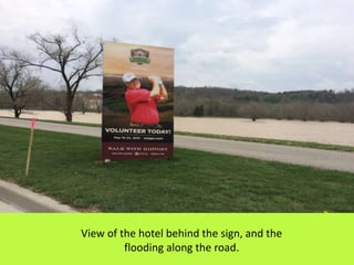 View of the hotel behind the sign, and the
flooding along the road.
 