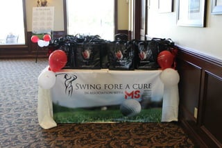 Swing Fore A Cure - Signage and Swag bags