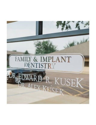 Signage on the glass pane at Kusek Family & Implant Dentistry Sioux Falls SD.pdf