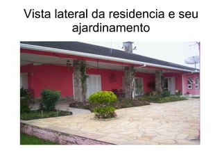 Vista lateral da residencia e seu ajardinamento 