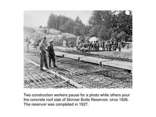 Two construction workers pause for a photo while others pour the concrete roof slab of Skinner Butte Reservoir, circa 1926...