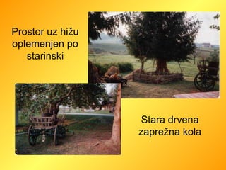 Prostor uz hižu oplemenjen po starinski Stara drvena zaprežna kola 