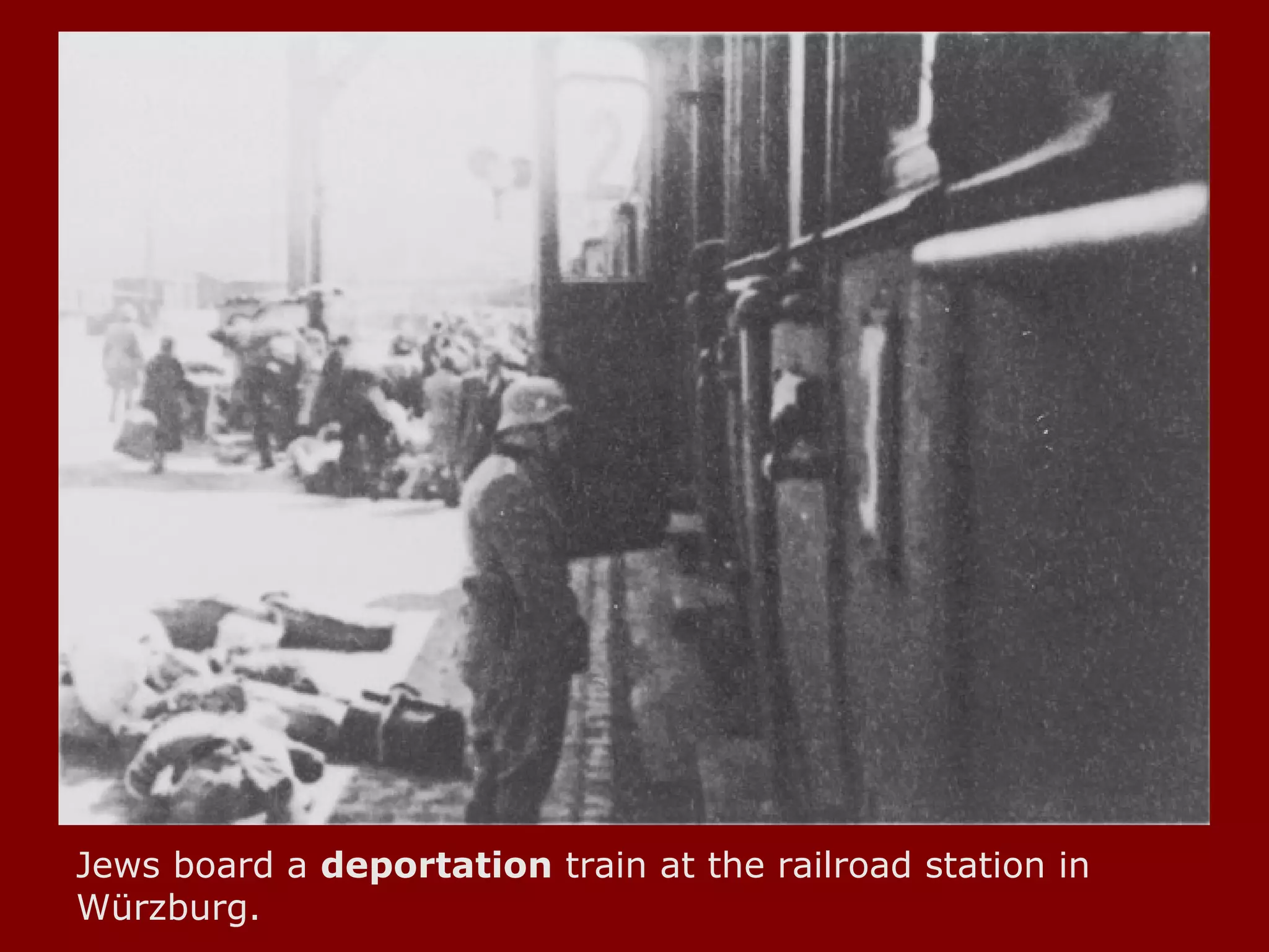 Jews board a  deportation  train at the railroad station in Würzburg.  
