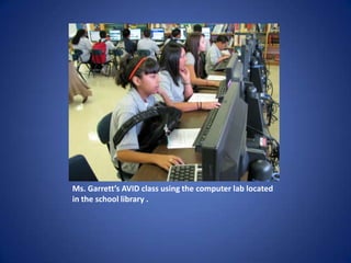 Ms. Garrett’s AVID class using the computer lab located in the school library .