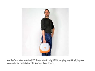Apple Computer interim CEO Steve Jobs in July 1999 carrying new iBook, laptop
computer w. built-in handle, Apple's iMac to go
 