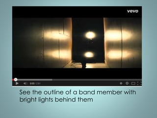 See the outline of a band member with 
bright lights behind them 
 