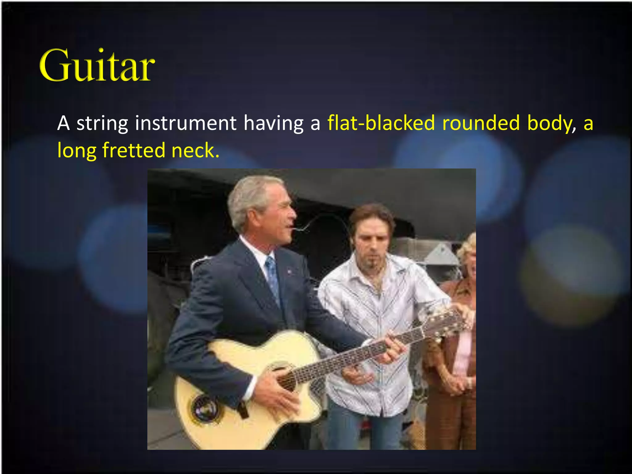 A string instrument having a flat-blacked rounded body, a
long fretted neck.
 