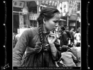 Young mother carrying a child on her back in the market, Hong Kong Island, 1946-1947.
 