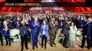 FROM COMMITMENTS…
Photo: COP Paris/Flickr
 