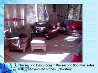 The second living room in the second floor has sofas  with green and red stripes upholstery. 
