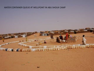 WATER CONTAINER QUEUE AT WELLPOINT IN ABU SHOUK CAMP
 