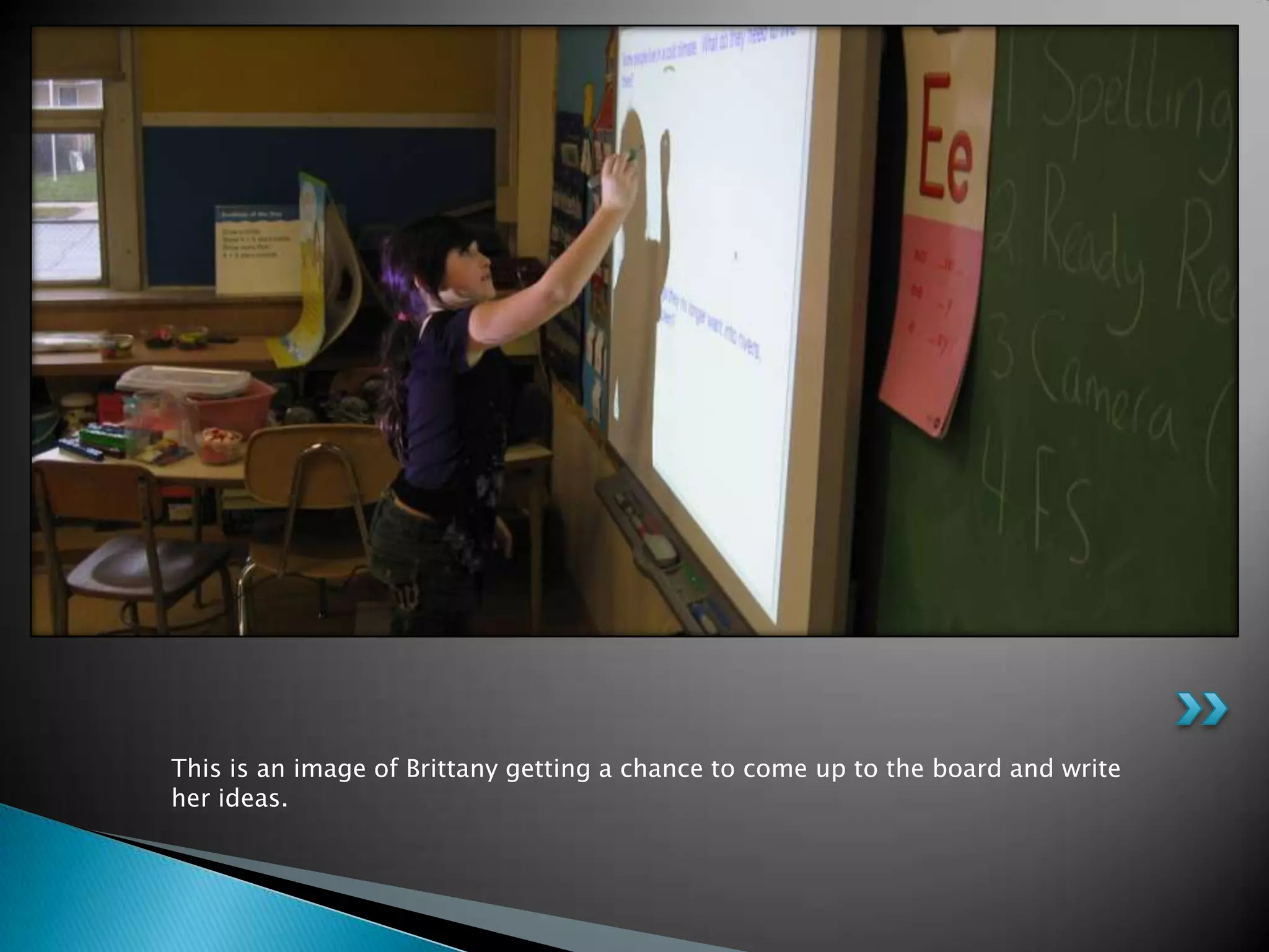 This is an image of Brittany getting a chance to come up to the board and write her ideas.