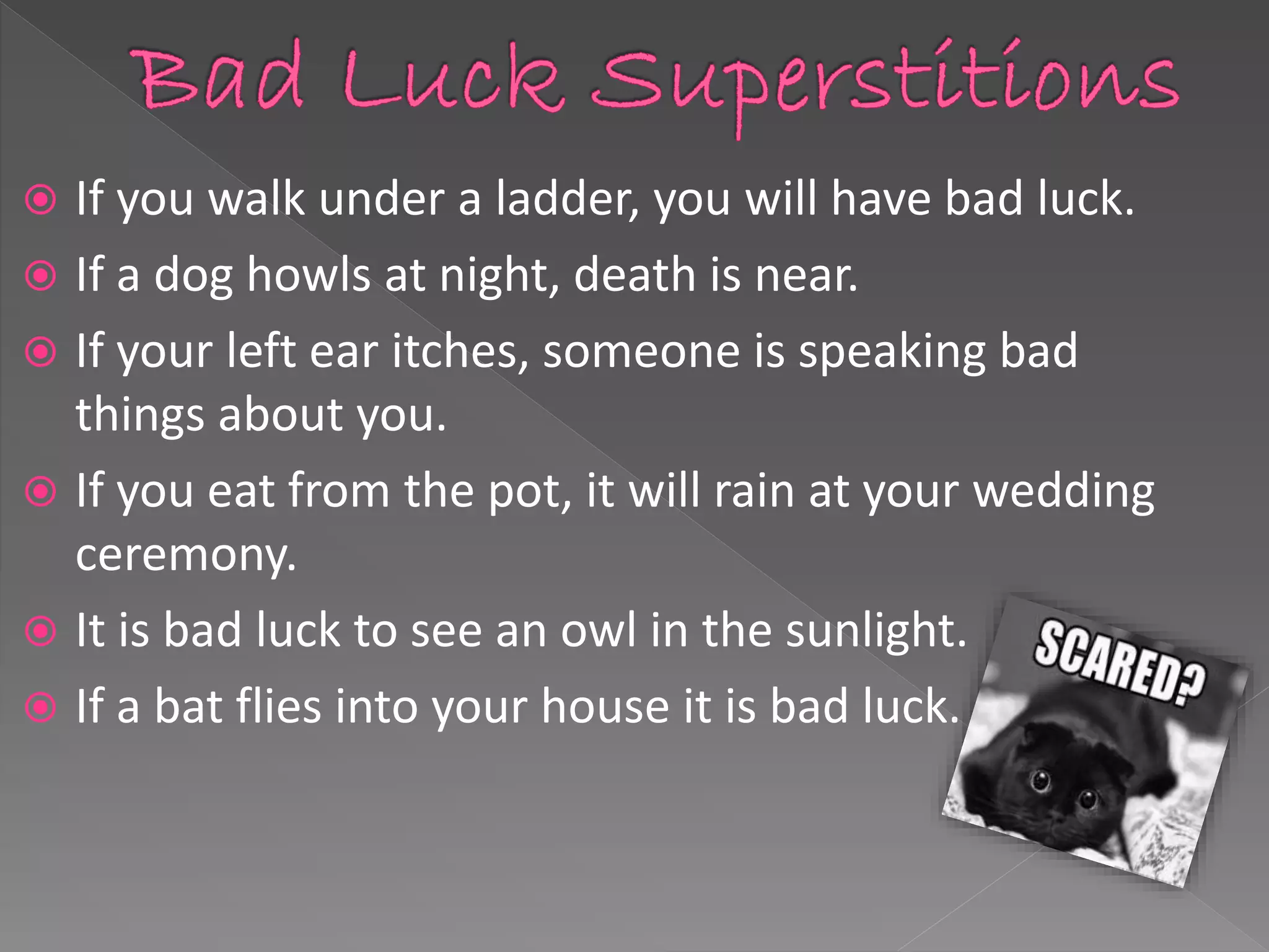 Presentation slide listing common bad luck superstitions including walking under a ladder
