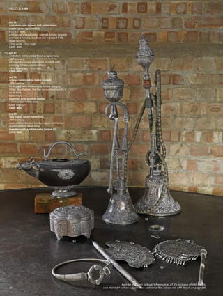 Lot 96
An Indian coco de mer and white metal
water carrier (goumukhi),
Kutch, c.1890,
with a cow’s head spout, pierced foliate mounts
and cobra handle, the foot rim stamped T.90,
cover lacking,
37cm wide, 27cm high
£400 - 600
Lot 97
An Indian white metal betel or spice box,
20th century,
of lobed form and decorated in relief with
scrolling foliage, on short feet,
19cm diameter, 11cm high
£200 - 400
Lot 98
A large Indian white metal hookah,
20th century,
embossed with flowers and foliate designs,
fitted mouthpiece, the burner surmounted by a
small bird,
65cm high,
together with another similar,
with braided fabric pipe,
82cm high (2)
£500 - 800
Lot 99
Two Indian white metal fans,
20th century,
each with embossed heads, edged with bells,
approximately 36cm long,
together with a white metal torque (3)
£200 - 300
96
97
98
99
Each lot is subject to Buyer’s Premium at 27.6% inclusive of VAT @ 20%
Lots marked * will be subject to an additional fee - please see ARR details on page 20032
SILVER 1-99
 