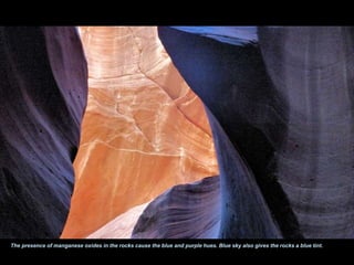 The presence of manganese oxides in the rocks cause the blue and purple hues. Blue sky also gives the rocks a blue tint. 
 
