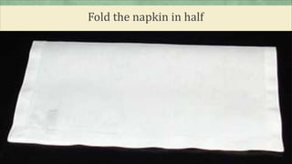 Fold the napkin in half
 