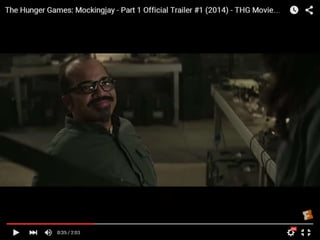 Mid shot of Bedee who we can tell looks
like a technical wizard as he gives
Katniss weapons
 