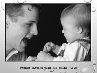 FATHER PLAYING WITH HIS CHILD, 1998
 