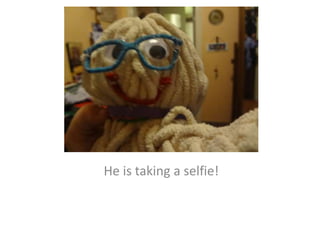 He is taking a selfie!
 