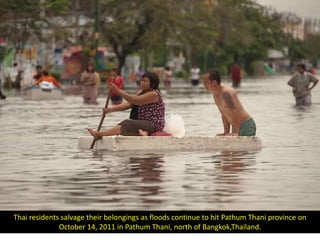 Thai residents salvage their belongings as floods continue to hit Pathum Thani province on
              October 14, 2011 in Pathum Thani, north of Bangkok,Thailand.
 