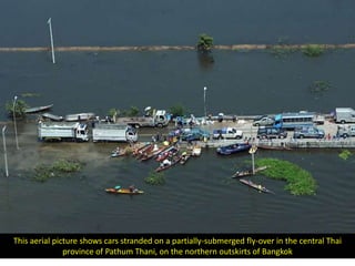 This aerial picture shows cars stranded on a partially-submerged fly-over in the central Thai
               province of Pathum Thani, on the northern outskirts of Bangkok
 
