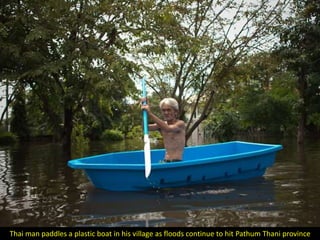 Thai man paddles a plastic boat in his village as floods continue to hit Pathum Thani province
 