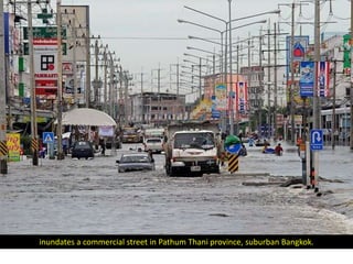 inundates a commercial street in Pathum Thani province, suburban Bangkok.
 