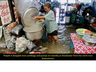 People in Bangkok have sandbags and pumps on standby as floodwater from the north runs
                                     downstream
 