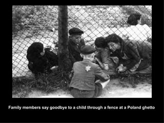 Family members say goodbye to a child through a fence at a Poland ghetto 