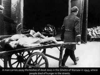 A man carries away the bodies of dead Jews in the Ghetto of Warsaw in 1943, where
                       people died of hunger in the streets.
 