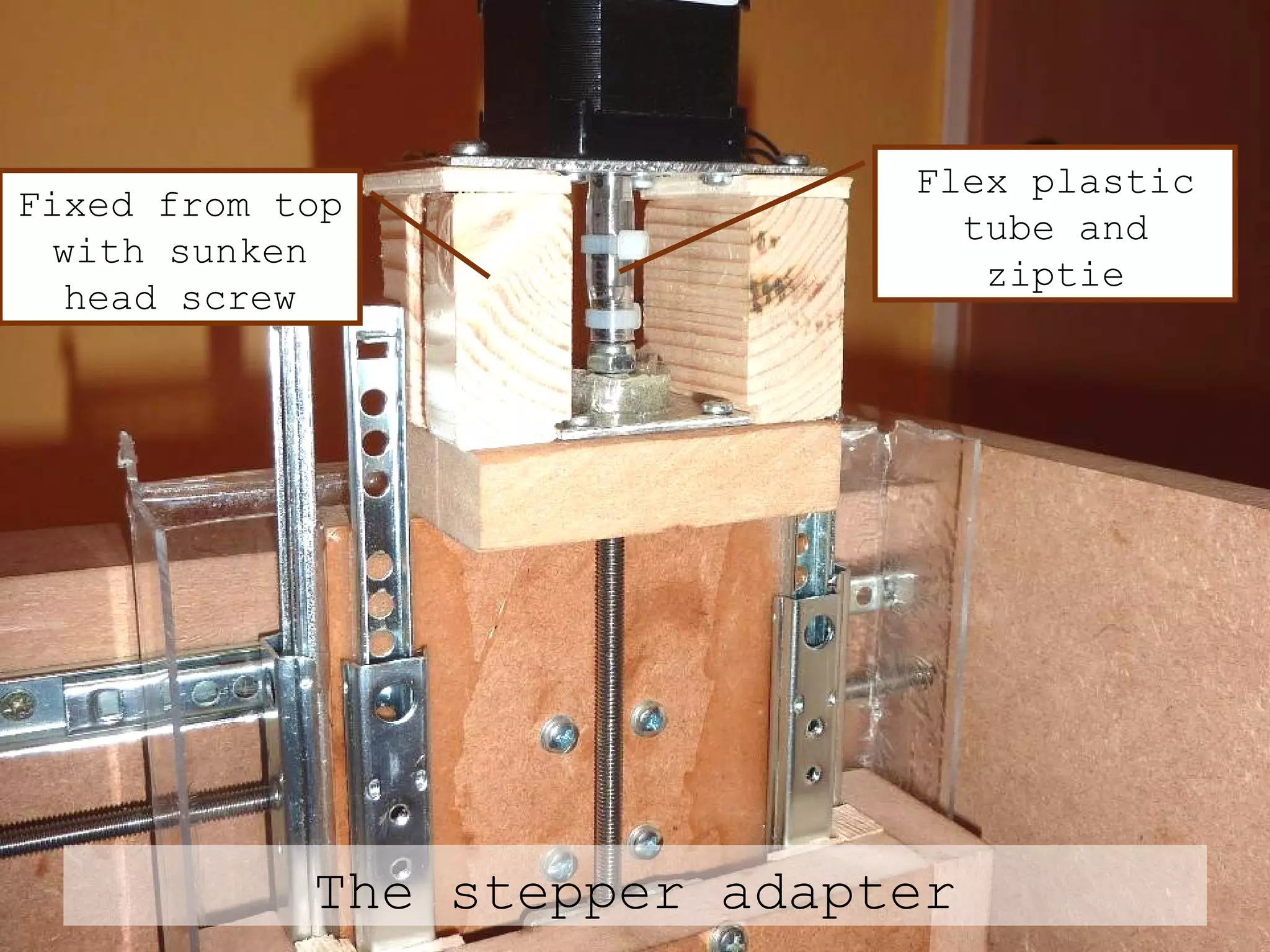 The stepper adapter Fixed from top with sunken head screw Flex plastic tube and ziptie 