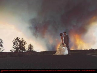 Josh Newton, newlyweds Michael Wolber and April Hartley pose for a picture near Bend, Ore. as a wildfire burns in the back...