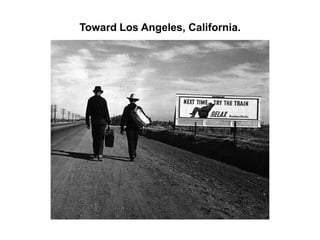 Farmer and sons walking in the face of a dust storm. Cimarron County, Oklahoma.