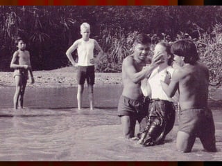 Kim and Dyuwi  (who took part in the spearings and killings)  baptize Kathy Saint while Steve waits to be next. 