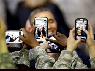 U.S. soldiers take pictures of President Barack Obama after he delivered a speech at U.S. military base Yongsan Garrison in Seoul, South Korea, on April 26, 2014. Lee Jin-man/Reuters
 