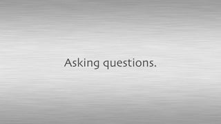 Asking questions.
 
