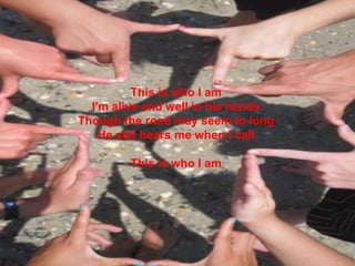 This is who I amI'm alive and well in his handsThough the road may seem to longHe still hears me when I call This is who I am