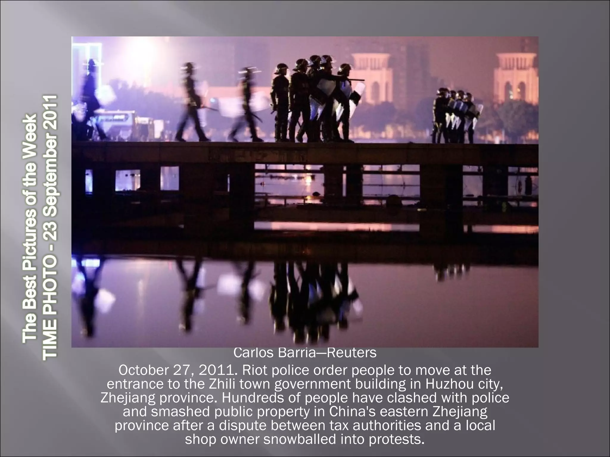 Carlos Barria—Reuters October 27, 2011. Riot police order people to move at the entrance to the Zhili town government building in Huzhou city, Zhejiang province. Hundreds of people have clashed with police and smashed public property in China's eastern Zhejiang province after a dispute between tax authorities and a local shop owner snowballed into protests. 