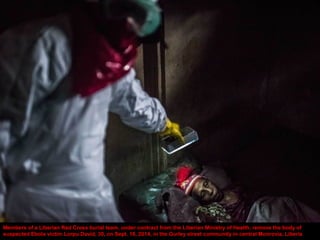 A buria l team collects the body of a 75-year -old woman in a neighborhood called PHP in Monrovia, Liberia, Sept. 18, 2014...