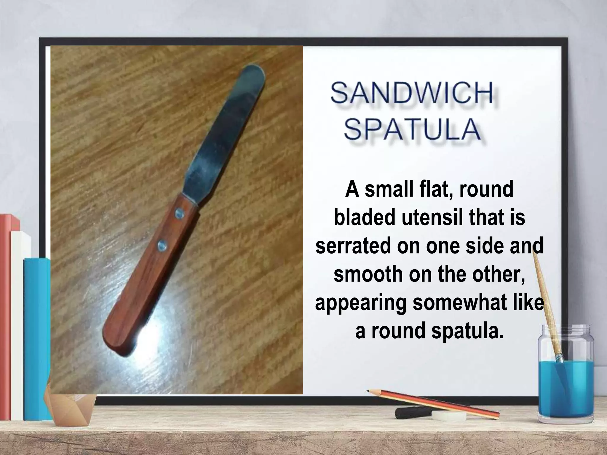 A small flat, round
bladed utensil that is
serrated on one side and
smooth on the other,
appearing somewhat like
a round spatula.
 