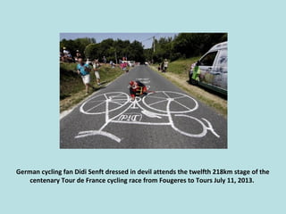 German cycling fan Didi Senft dressed in devil attends the twelfth 218km stage of the
centenary Tour de France cycling rac...