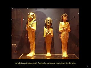 Ushebti con tocado real. Original en madera parcialmente dorado.
                                                                   37
 