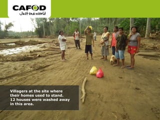 Villagers at the site where their homes used to stand.  12 houses were washed away in this area.  