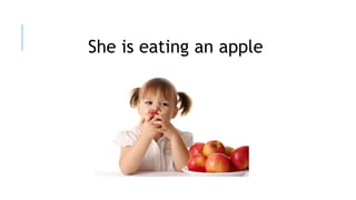 She is eating an apple
 