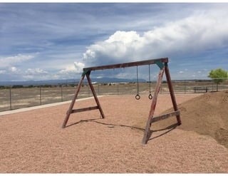 Upcycled swing set to shaded sandbox