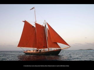 A red-sailed ship is seen sailing toward Salisbury Beach, Massachusetts on July 9th, 2008 (Boston Globe)   