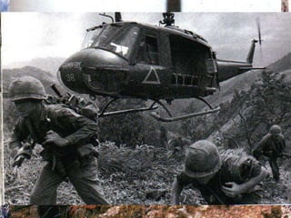 A Huey hovers to off-load members of the 101 st  Airborne (WWII’s famous  “Screaming Eagles ”) in a search-and-destroy mission near the DMZ 